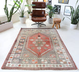 Vintage Turkish rug in living room setting, old rug, antique rug, pastel colors, faded colors, Turkish rug, vintage rug, soft rug, Portland, Oregon, rug store, rug shop, local shop