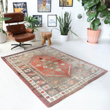 Vintage Turkish rug in living room setting, old rug, antique rug, pastel colors, faded colors, Turkish rug, vintage rug, soft rug, Portland, Oregon, rug store, rug shop, local shop