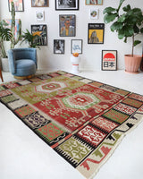 Vintage kilim rug in living room setting, old rug, antique rug, pastel colors, faded colors, Turkish rug, vintage rug, soft rug, Portland, Oregon, rug store, rug shop, local shop, earthy tones, earthy colors, warm colors