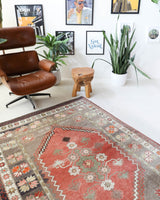 Vintage Turkish rug in living room setting, old rug, antique rug, pastel colors, faded colors, Turkish rug, vintage rug, soft rug, Portland, Oregon, rug store, rug shop, local shop