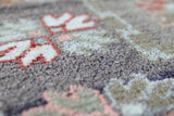 Vintage Turkish rug in living room setting, old rug, antique rug, pastel colors, faded colors, Turkish rug, vintage rug, soft rug, Portland, Oregon, rug store, rug shop, local shop