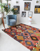 Vintage kilim rug in living room setting, bright colors, wild shaman, soft rug, bold color, Portland, Oregon, rug store, rug shop, local shop, vintage rug, modern kilim, warm colors