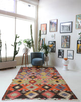 Vintage kilim rug in living room setting, bright colors, wild shaman, soft rug, bold color, Portland, Oregon, rug store, rug shop, local shop, vintage rug, modern kilim, warm colors