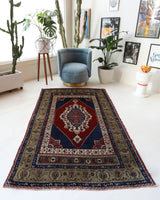 Antique Turkish rug in a living room setting, pile rug, Turkish rug, vintage rug, portland, rug shop, bright colors, wild shaman, soft rug, bold color, Portland, Oregon, rug store, rug shop, local shop, antique rug