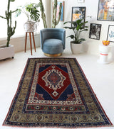 Antique Turkish rug in a living room setting, pile rug, Turkish rug, vintage rug, portland, rug shop, bright colors, wild shaman, soft rug, bold color, Portland, Oregon, rug store, rug shop, local shop, antique rug