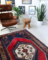 Vintage Turkish rug in a living room setting, pile rug, Turkish rug, vintage rug, portland, rug shop, bright colors, wild shaman, soft rug, bold color, Portland, Oregon, rug store, rug shop, local shop, antique rug