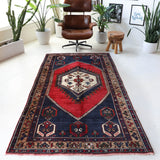 Vintage Turkish rug in a living room setting, pile rug, Turkish rug, vintage rug, portland, rug shop, bright colors, wild shaman, soft rug, bold color, Portland, Oregon, rug store, rug shop, local shop, antique rug