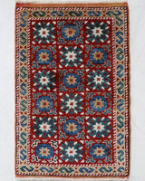 Vintage Turkish rug in a living room setting, pile rug, Turkish rug, vintage rug, portland, rug shop, bright colors, wild shaman, soft rug, bold color, Portland, Oregon, rug store, rug shop, local shop, antique rug
