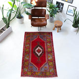 Vintage Turkish rug in a living room setting, pile rug, Turkish rug, vintage rug, portland, rug shop, bright colors, wild shaman, soft rug, bold color, Portland, Oregon, rug store, rug shop, local shop, antique rug