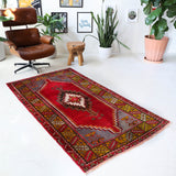 Vintage Turkish rug in a living room setting, pile rug, Turkish rug, vintage rug, portland, rug shop, bright colors, wild shaman, soft rug, bold color, Portland, Oregon, rug store, rug shop, local shop, antique rug