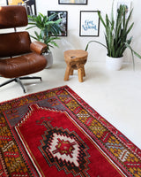 Vintage Turkish rug in a living room setting, pile rug, Turkish rug, vintage rug, portland, rug shop, bright colors, wild shaman, soft rug, bold color, Portland, Oregon, rug store, rug shop, local shop, antique rug