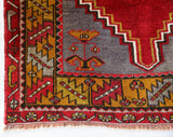Vintage Turkish rug in a living room setting, pile rug, Turkish rug, vintage rug, portland, rug shop, bright colors, wild shaman, soft rug, bold color, Portland, Oregon, rug store, rug shop, local shop, antique rug
