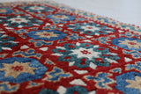 Vintage Turkish rug in a living room setting, pile rug, Turkish rug, vintage rug, portland, rug shop, bright colors, wild shaman, soft rug, bold color, Portland, Oregon, rug store, rug shop, local shop, antique rug