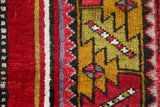 Vintage Turkish rug in a living room setting, pile rug, Turkish rug, vintage rug, portland, rug shop, bright colors, wild shaman, soft rug, bold color, Portland, Oregon, rug store, rug shop, local shop, antique rug