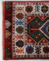 Vintage Turkish rug in a living room setting, pile rug, Turkish rug, vintage rug, portland, rug shop, bright colors, wild shaman, soft rug, bold color, Portland, Oregon, rug store, rug shop, local shop, antique rug