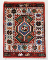 Vintage Turkish rug in a living room setting, pile rug, Turkish rug, vintage rug, portland, rug shop, bright colors, wild shaman, soft rug, bold color, Portland, Oregon, rug store, rug shop, local shop, antique rug