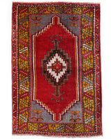 Vintage Turkish rug in a living room setting, pile rug, Turkish rug, vintage rug, portland, rug shop, bright colors, wild shaman, soft rug, bold color, Portland, Oregon, rug store, rug shop, local shop, antique rug