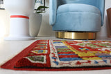 Vintage Turkish rug in a living room setting, pile rug, Turkish rug, vintage rug, portland, rug shop, bright colors, wild shaman, soft rug, bold color, Portland, Oregon, rug store, rug shop, local shop, antique rug