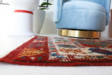 Vintage Turkish rug in a living room setting, pile rug, Turkish rug, vintage rug, portland, rug shop, bright colors, wild shaman, soft rug, bold color, Portland, Oregon, rug store, rug shop, local shop, antique rug