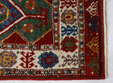 Vintage Turkish rug in a living room setting, pile rug, Turkish rug, vintage rug, portland, rug shop, bright colors, wild shaman, soft rug, bold color, Portland, Oregon, rug store, rug shop, local shop, antique rug
