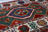 Vintage Turkish rug in a living room setting, pile rug, Turkish rug, vintage rug, portland, rug shop, bright colors, wild shaman, soft rug, bold color, Portland, Oregon, rug store, rug shop, local shop, antique rug