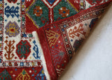Vintage Turkish rug in a living room setting, pile rug, Turkish rug, vintage rug, portland, rug shop, bright colors, wild shaman, soft rug, bold color, Portland, Oregon, rug store, rug shop, local shop, antique rug