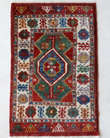 Vintage Turkish rug in a living room setting, pile rug, Turkish rug, vintage rug, portland, rug shop, bright colors, wild shaman, soft rug, bold color, Portland, Oregon, rug store, rug shop, local shop, antique rug