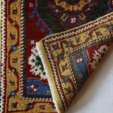 Vintage Turkish rug in a living room setting, pile rug, Turkish rug, vintage rug, portland, rug shop, bright colors, wild shaman, soft rug, bold color, Portland, Oregon, rug store, rug shop, local shop, antique rug
