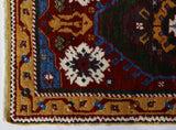 Vintage Turkish rug in a living room setting, pile rug, Turkish rug, vintage rug, portland, rug shop, bright colors, wild shaman, soft rug, bold color, Portland, Oregon, rug store, rug shop, local shop, antique rug
