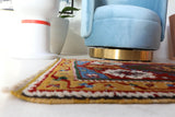 Vintage Turkish rug in a living room setting, pile rug, Turkish rug, vintage rug, portland, rug shop, bright colors, wild shaman, soft rug, bold color, Portland, Oregon, rug store, rug shop, local shop, antique rug