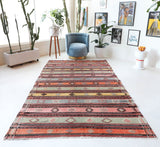 Vintage kilim rug in room decor setting, old rug, antique rug, pastel colors, faded colors, Turkish rug, vintage rug, soft rug, Portland, Oregon, rug store, rug shop, local shop, bold colors, bright colors, faded colors