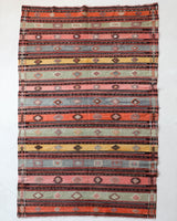 Vintage kilim rug in room decor setting, old rug, antique rug, pastel colors, faded colors, Turkish rug, vintage rug, soft rug, Portland, Oregon, rug store, rug shop, local shop, bold colors, bright colors, faded colors