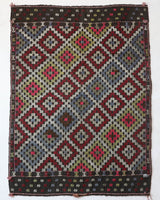 Vintage kilim rug in room decor setting, old rug, antique rug, pastel colors, faded colors, Turkish rug, vintage rug, soft rug, Portland, Oregon, rug store, rug shop, local shop, bold colors, bright colors, faded colors