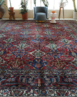 Antique Persian area rug in a living room setting, pile rug, vintage rug, portland, rug shop, bright colors, wild shaman, soft rug, bold color, Portland, Oregon, rug store, rug shop, local shop, antique rug, Persian rug, handmade rug, wool rug, distressed rug