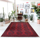 Antique Turkmen rug in a living room setting, pile rug, Turkish rug, vintage rug, portland, rug shop, bright colors, wild shaman, soft rug, bold color, Portland, Oregon, rug store, rug shop, local shop, antique rug