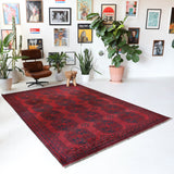 Antique Turkmen rug in a living room setting, pile rug, Turkish rug, vintage rug, portland, rug shop, bright colors, wild shaman, soft rug, bold color, Portland, Oregon, rug store, rug shop, local shop, antique rug