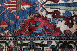 Antique Persian area rug in a living room setting, pile rug, vintage rug, portland, rug shop, bright colors, wild shaman, soft rug, bold color, Portland, Oregon, rug store, rug shop, local shop, antique rug, Persian rug, handmade rug, wool rug, distressed rug