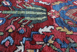 Antique Persian area rug in a living room setting, pile rug, vintage rug, portland, rug shop, bright colors, wild shaman, soft rug, bold color, Portland, Oregon, rug store, rug shop, local shop, antique rug, Persian rug, handmade rug, wool rug, distressed rug
