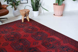 Antique Turkmen rug in a living room setting, pile rug, Turkish rug, vintage rug, portland, rug shop, bright colors, wild shaman, soft rug, bold color, Portland, Oregon, rug store, rug shop, local shop, antique rug