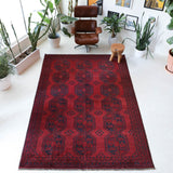 Antique Turkmen rug in a living room setting, pile rug, Turkish rug, vintage rug, portland, rug shop, bright colors, wild shaman, soft rug, bold color, Portland, Oregon, rug store, rug shop, local shop, antique rug