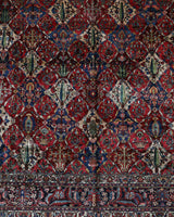 Antique Persian area rug in a living room setting, pile rug, vintage rug, portland, rug shop, bright colors, wild shaman, soft rug, bold color, Portland, Oregon, rug store, rug shop, local shop, antique rug, Persian rug, handmade rug, wool rug, distressed rug