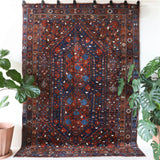 Antique Persian area rug in a living room setting, pile rug, vintage rug, portland, rug shop, bright colors, wild shaman, soft rug, bold color, Portland, Oregon, rug store, rug shop, local shop, antique rug, Persian rug, handmade rug, wool rug, distressed rug