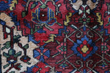Antique Persian area rug in a living room setting, pile rug, vintage rug, portland, rug shop, bright colors, wild shaman, soft rug, bold color, Portland, Oregon, rug store, rug shop, local shop, antique rug, Persian rug, handmade rug, wool rug, distressed rug