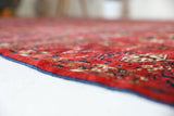 Antique Turkmen rug in a living room setting, pile rug, Turkish rug, vintage rug, portland, rug shop, bright colors, wild shaman, soft rug, bold color, Portland, Oregon, rug store, rug shop, local shop, antique rug