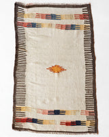 Vintage kilim rug in living room setting, old rug, antique rug, pastel colors, faded colors, Turkish rug, vintage rug, soft rug, Portland, Oregon, rug store, rug shop, local shop, earthy tones, earthy colors, warm colors