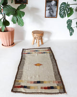 Vintage kilim rug in living room setting, old rug, antique rug, pastel colors, faded colors, Turkish rug, vintage rug, soft rug, Portland, Oregon, rug store, rug shop, local shop, earthy tones, earthy colors, warm colors