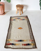 Vintage kilim rug in living room setting, old rug, antique rug, pastel colors, faded colors, Turkish rug, vintage rug, soft rug, Portland, Oregon, rug store, rug shop, local shop, earthy tones, earthy colors, warm colors