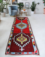 Vintage Turkish runner rug in a living room setting, pile rug, Turkish rug, vintage rug, portland, rug shop, bright colors, wild shaman, soft rug, bold color, Portland, Oregon, rug store, rug shop, local shop, antique rug