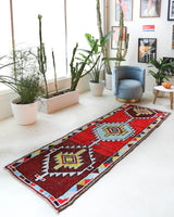 Vintage Turkish runner rug in a living room setting, pile rug, Turkish rug, vintage rug, portland, rug shop, bright colors, wild shaman, soft rug, bold color, Portland, Oregon, rug store, rug shop, local shop, antique rug