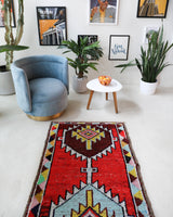 Vintage Turkish runner rug in a living room setting, pile rug, Turkish rug, vintage rug, portland, rug shop, bright colors, wild shaman, soft rug, bold color, Portland, Oregon, rug store, rug shop, local shop, antique rug